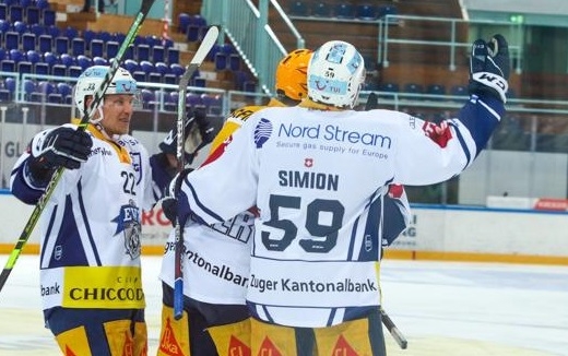 Photo hockey Suisse - National League -  : Genève vs Zug - D. Simion donne un puck de titre