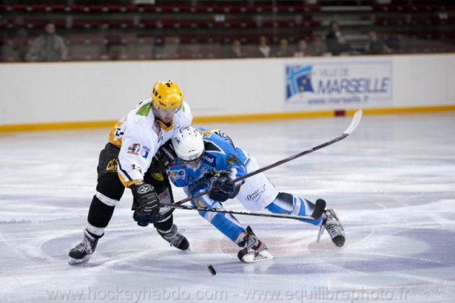Photo hockey reportage Sous le signe du 3